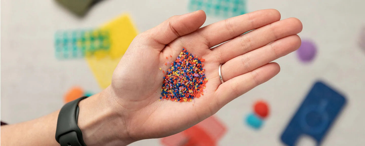 Hand holding colorful sprinkles with a blurred background