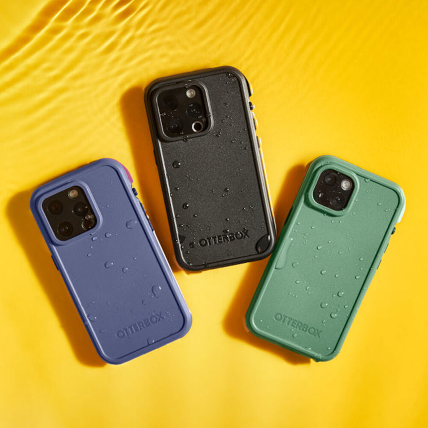 Three phone cases in blue, black, and green on a yellow background
