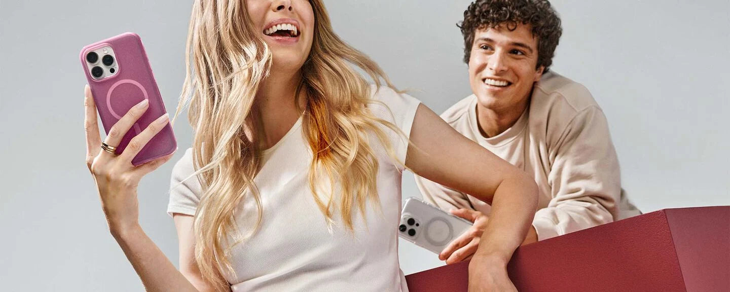Two people with a pink phone case and a red skateboard against a light background